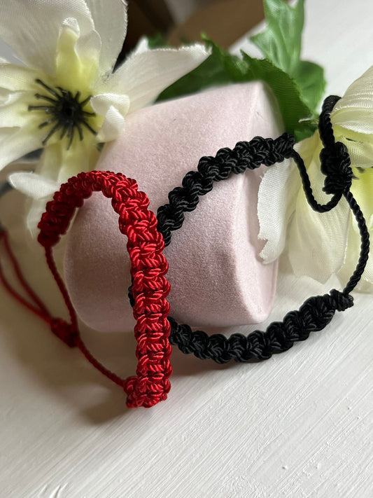 Set of red and black thread bracelets for couples: A symbol of eternal love